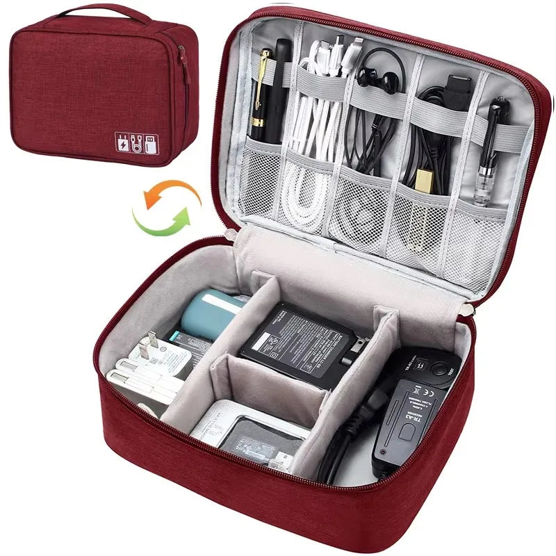 Red waterproof Oxford fabric electronic organizer bag, open with cables, chargers, and accessories neatly stored.
