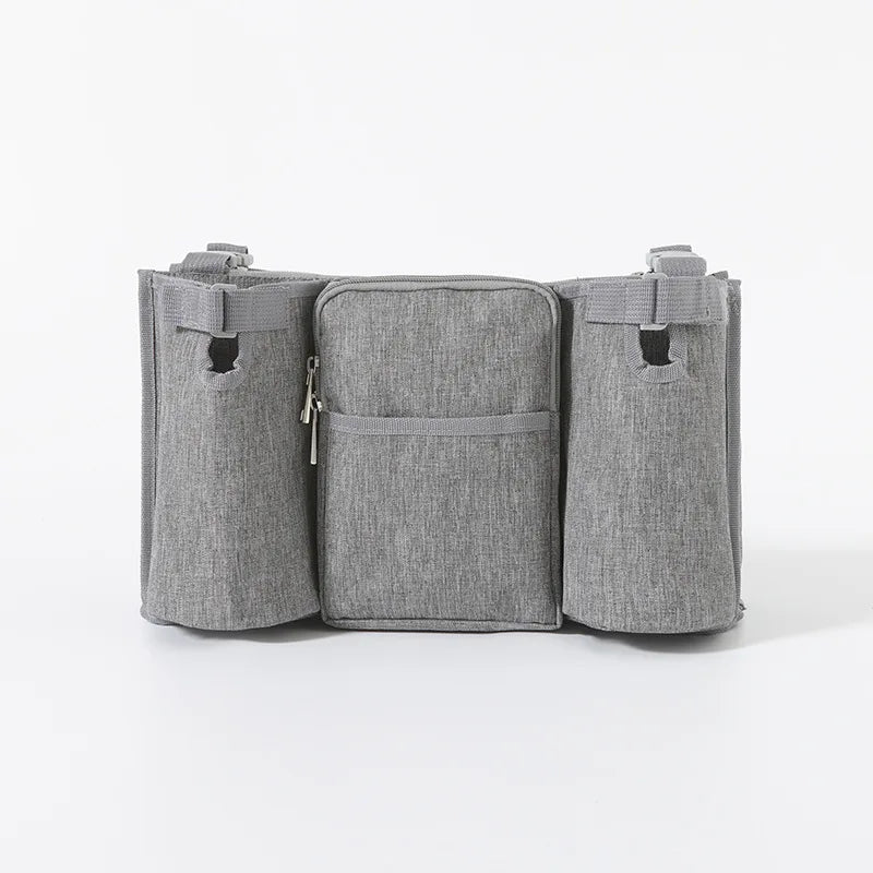 Gray waterproof stroller organizer bag with multiple compartments and zipper closure.