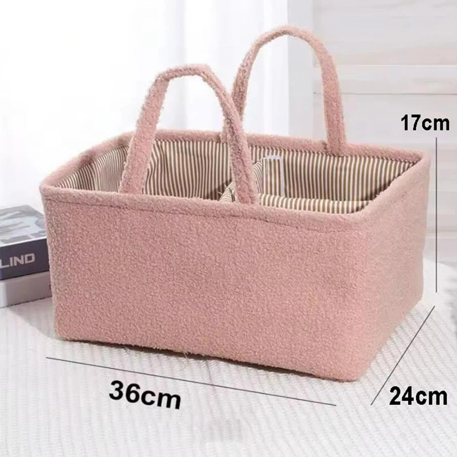 Pink fuzzy polyester portable diaper caddy with striped lining and handles, 36x24x17cm.