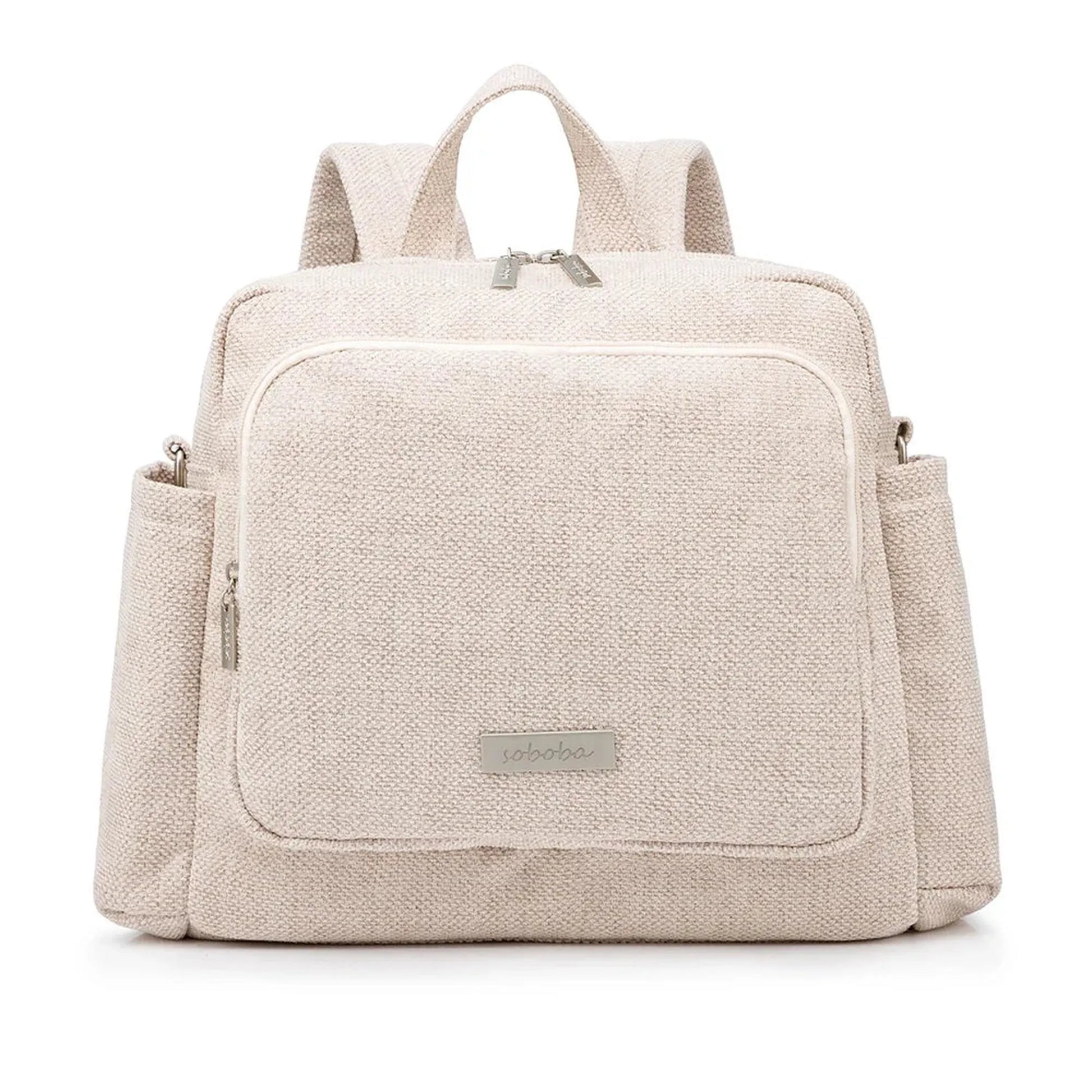 Beige textured waterproof diaper backpack with front pocket, side pockets, and silver zippers.