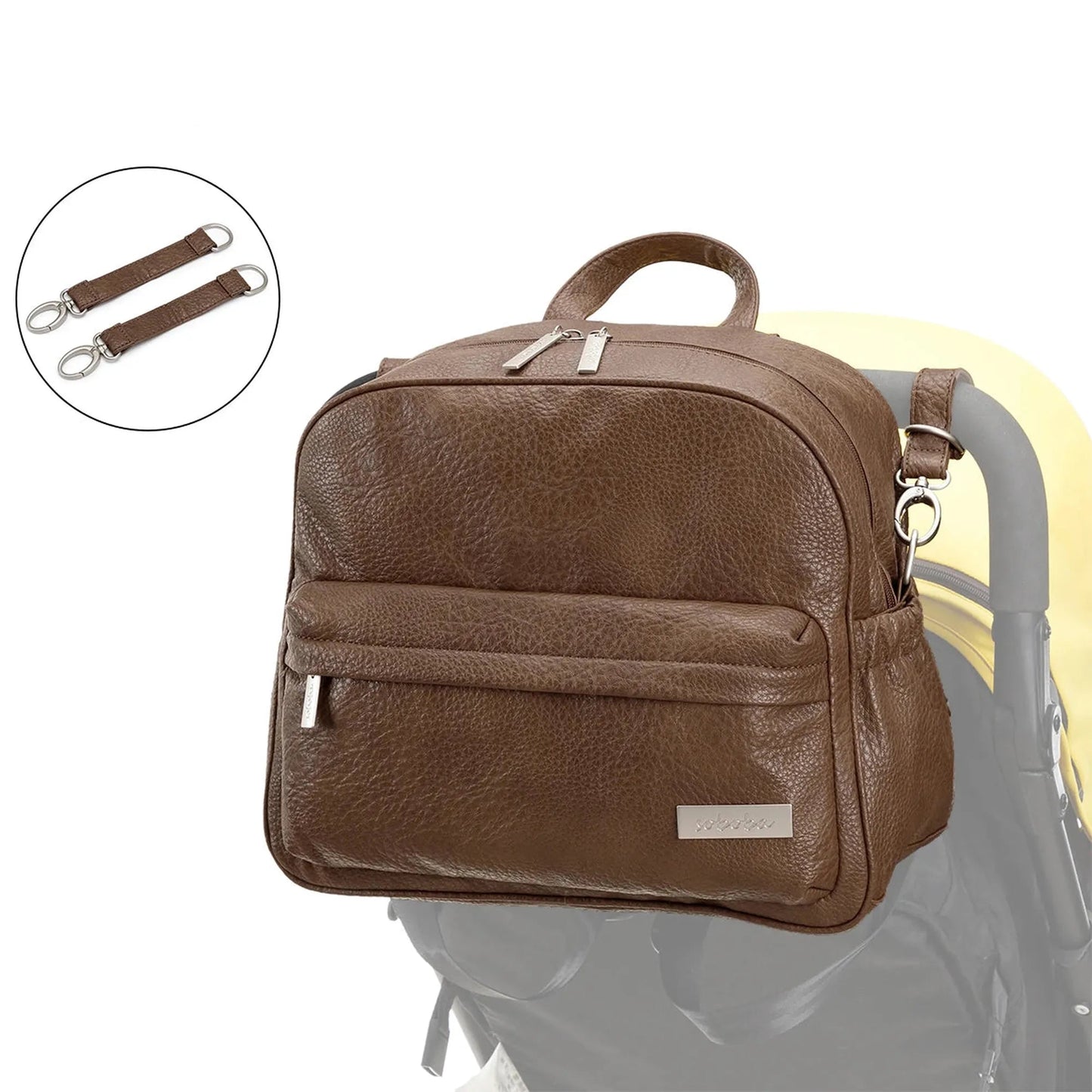 Brown PU/PVC diaper backpack on a stroller with detachable straps, featuring a front pocket and silver zippers.