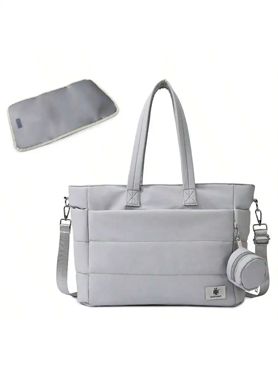 Light gray quilted diaper tote bag with shoulder strap, matching changing pad, and small pouch.
