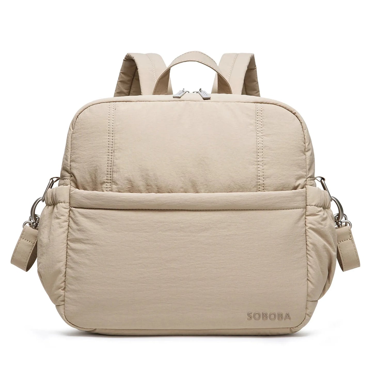 Beige multi-functional diaper backpack with padded straps, front pocket, and silver hardware.