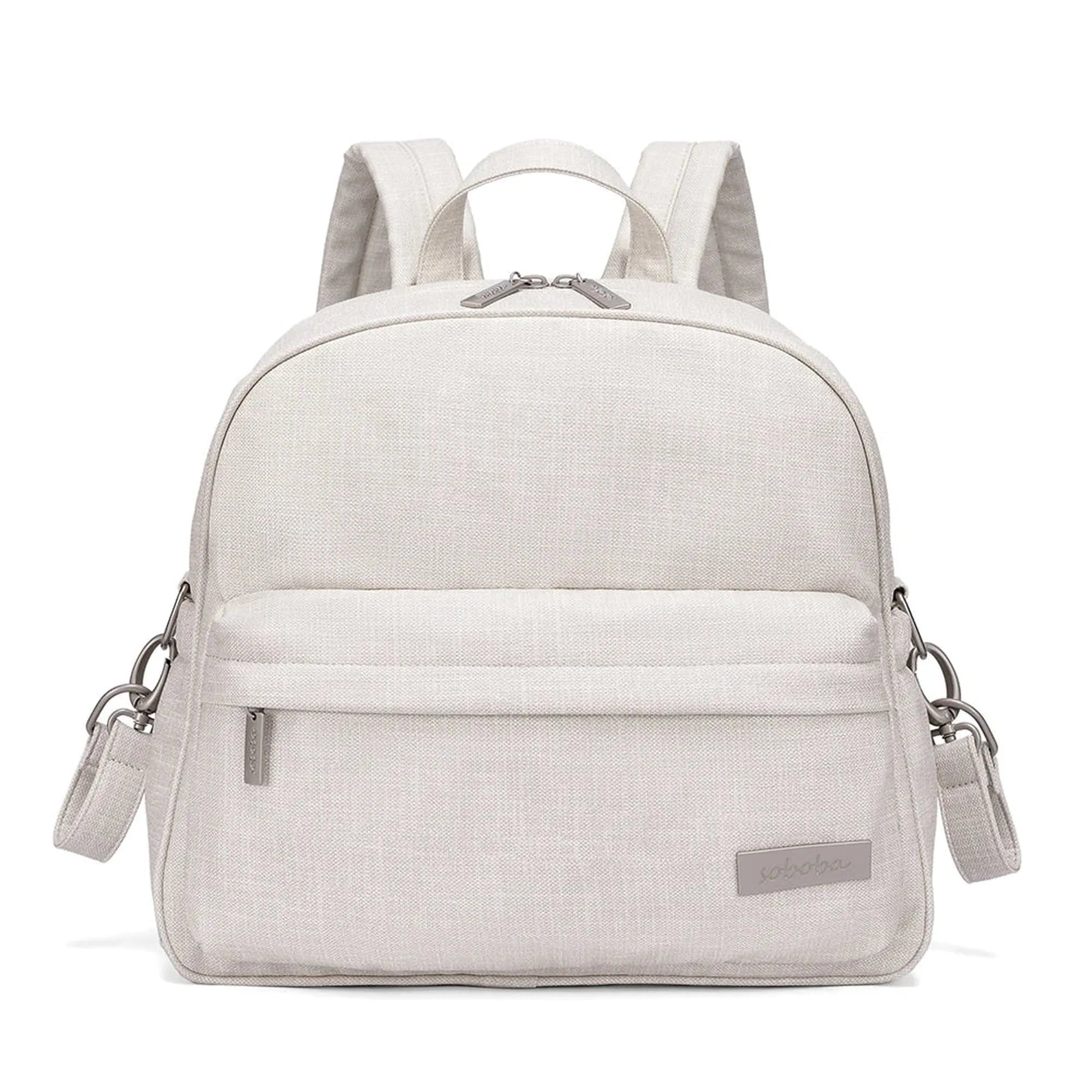 Stylish light beige linen-look diaper backpack with front pocket, top handle, and adjustable straps.
