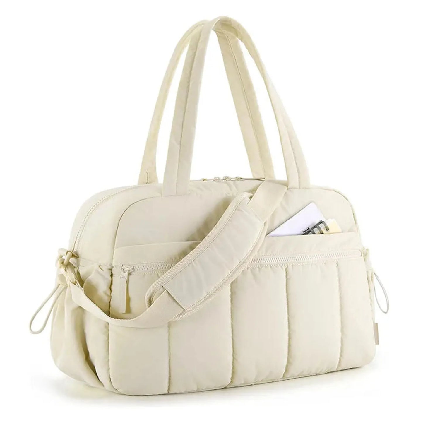 Cream quilted waterproof nylon diaper bag with top handles, shoulder strap, and front pocket.