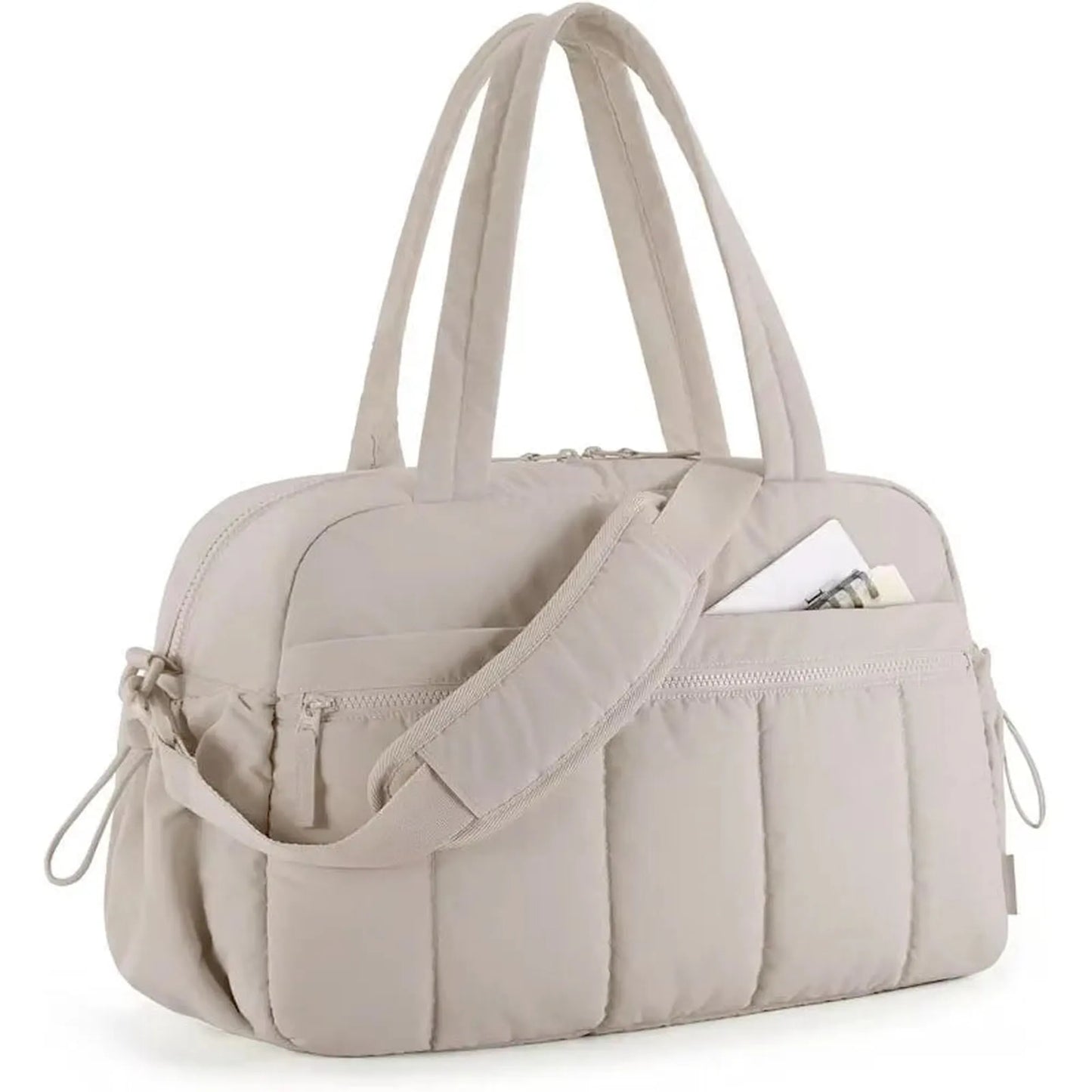 Beige quilted waterproof nylon diaper bag with top handles, shoulder strap, and front pocket.
