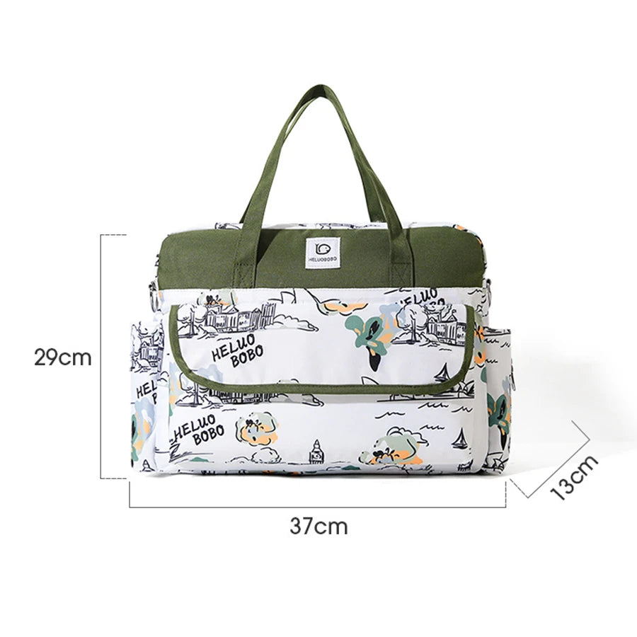 White and olive green waterproof Oxford fabric diaper bag with playful "HELLO BOBO" print and side pockets.