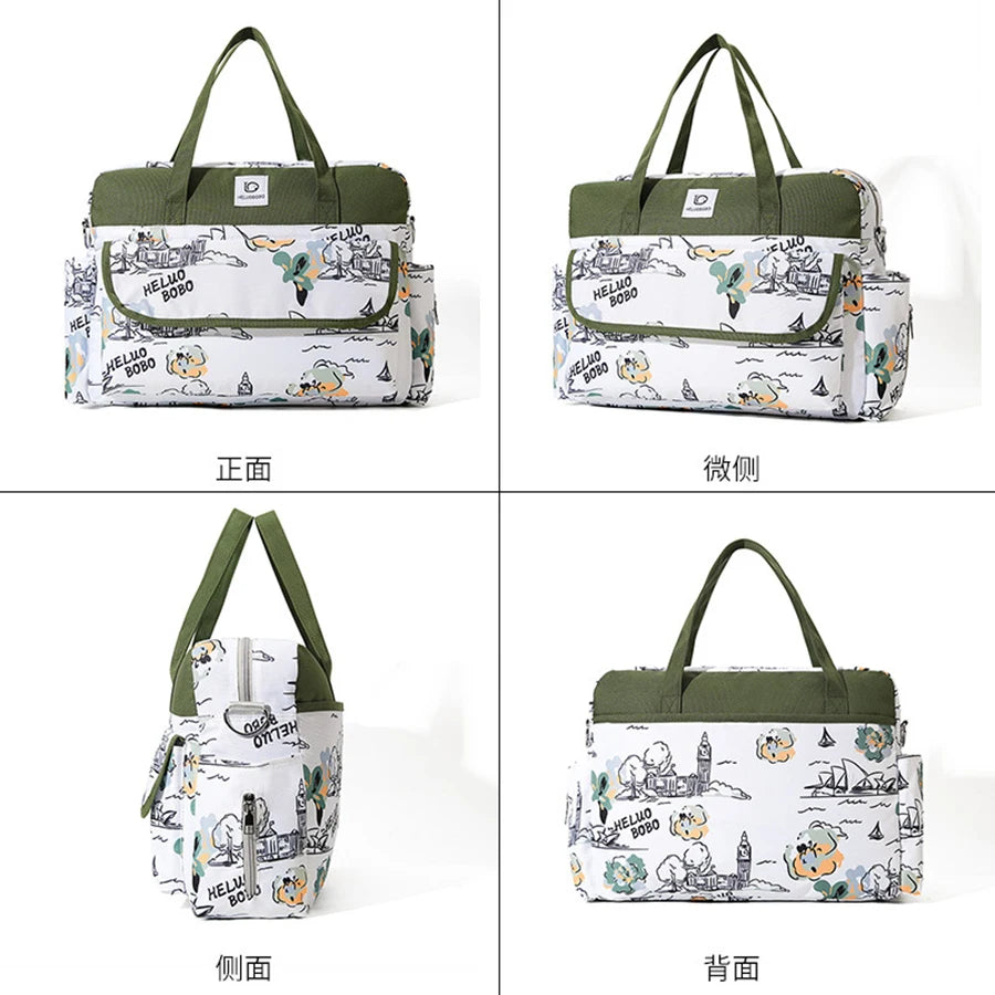 White and green Oxford waterproof diaper bag with cartoon print, multiple pockets, and top handles.