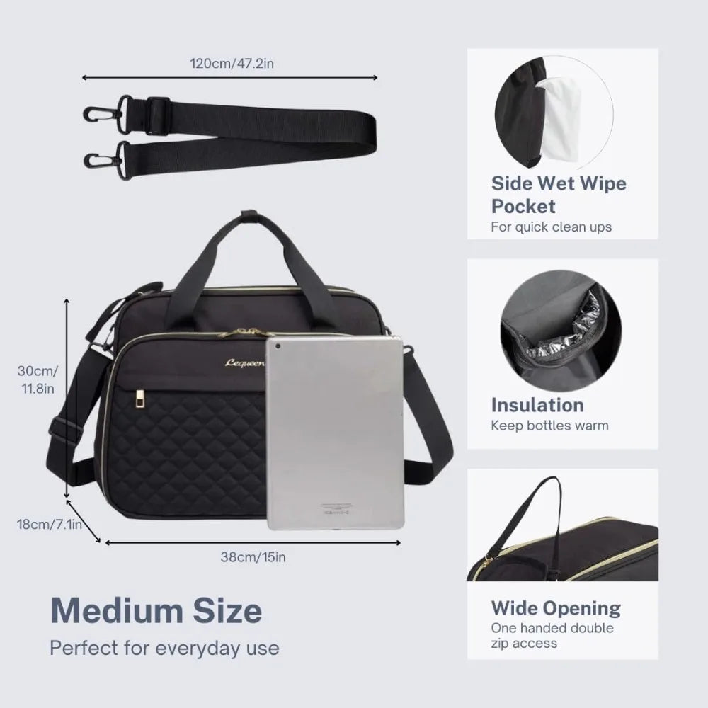 Black quilted diaper bag with shoulder strap, side wipe pocket, insulated compartment, and wide opening.