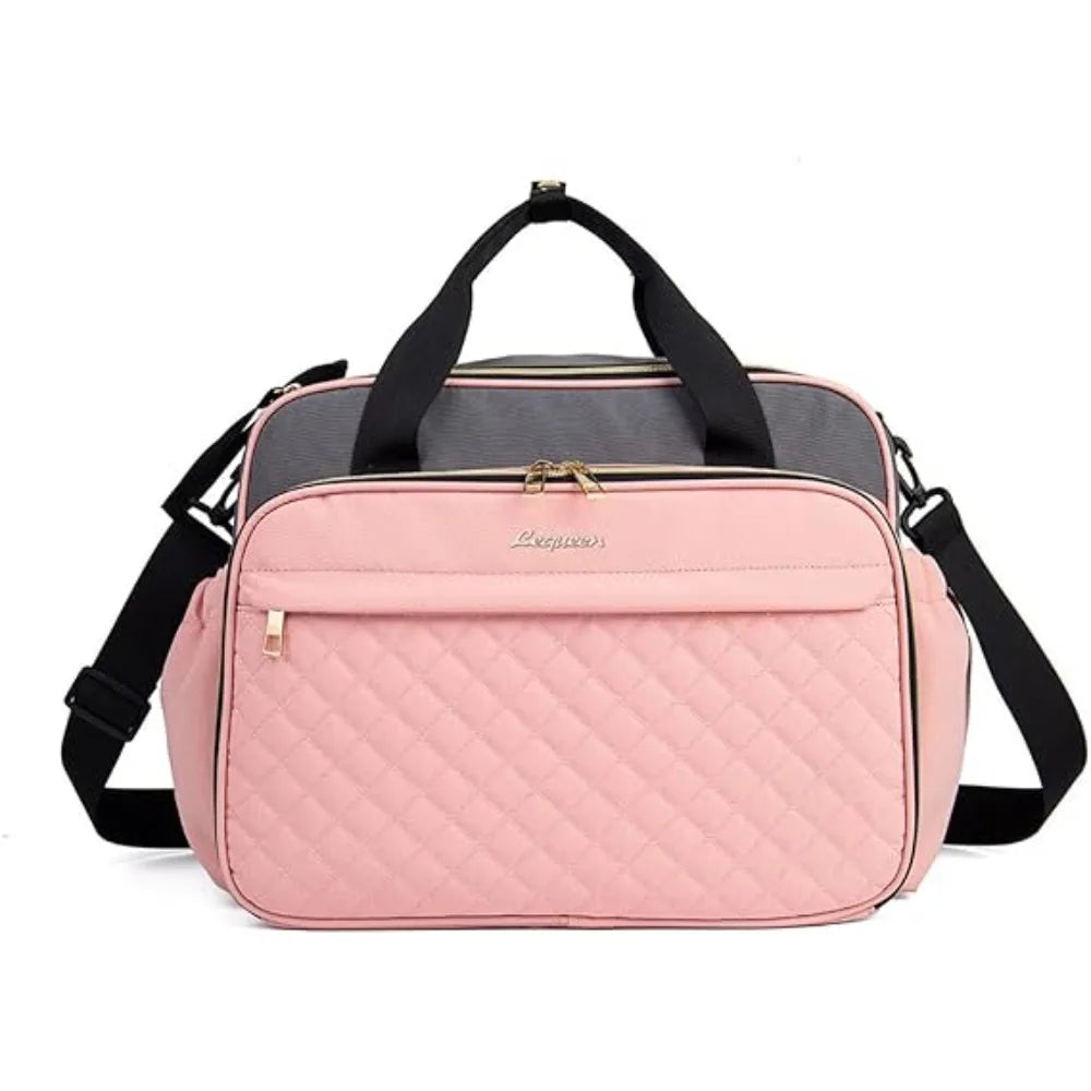 Pink and gray quilted waterproof diaper bag with multiple compartments and black straps.