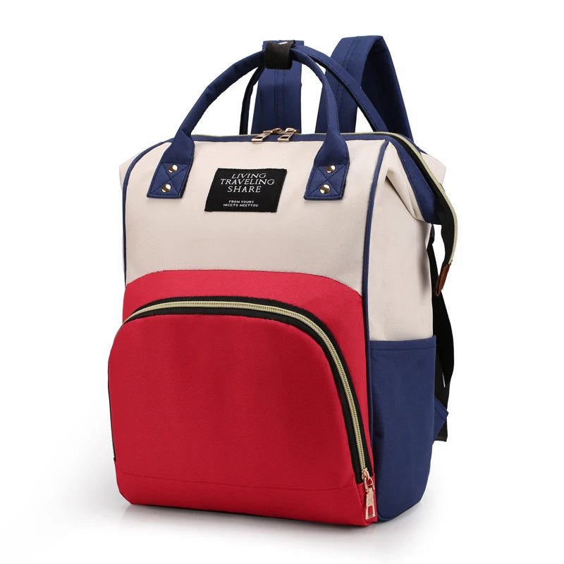 Multifunctional canvas diaper backpack in cream, red, and navy with thermal pocket.