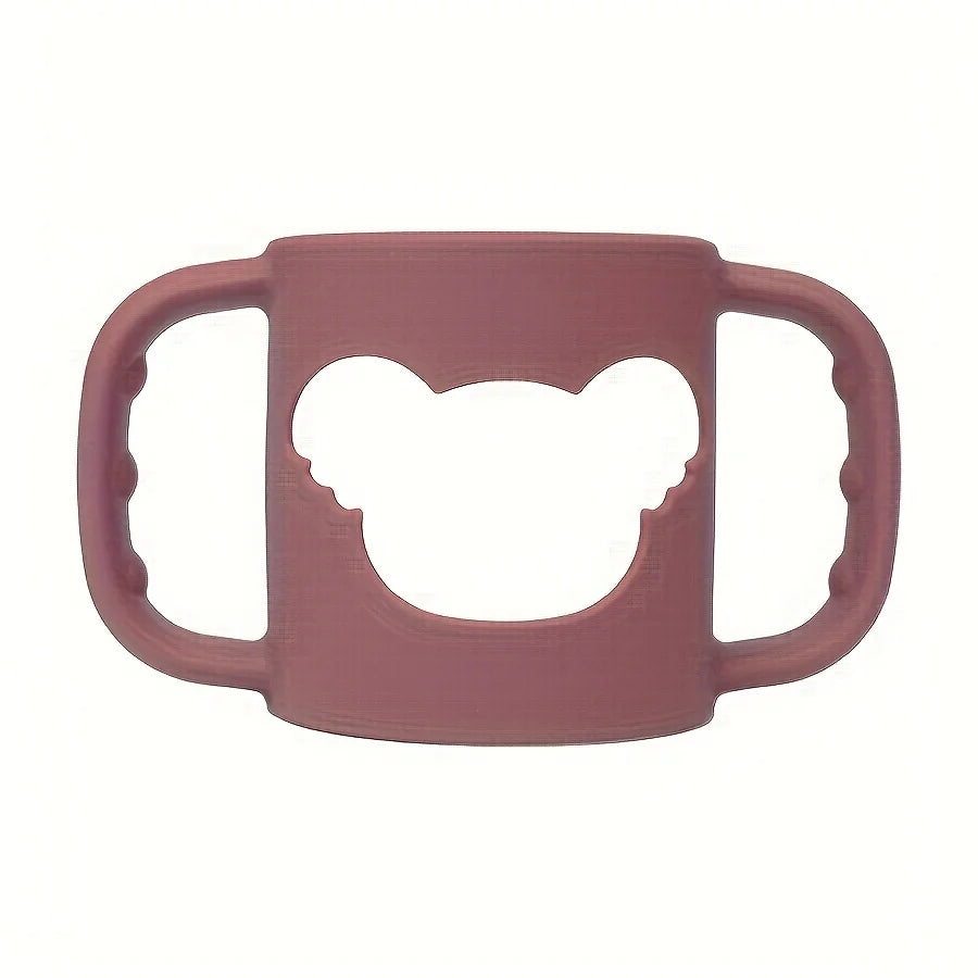 Soft pink silicone baby bottle handle with a bear-shaped cutout, designed for easy grip.