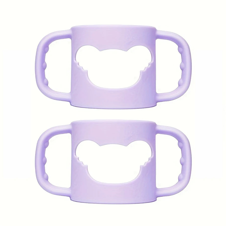 Two soft purple silicone baby bottle handles with bear-shaped cutouts, designed for easy grip.