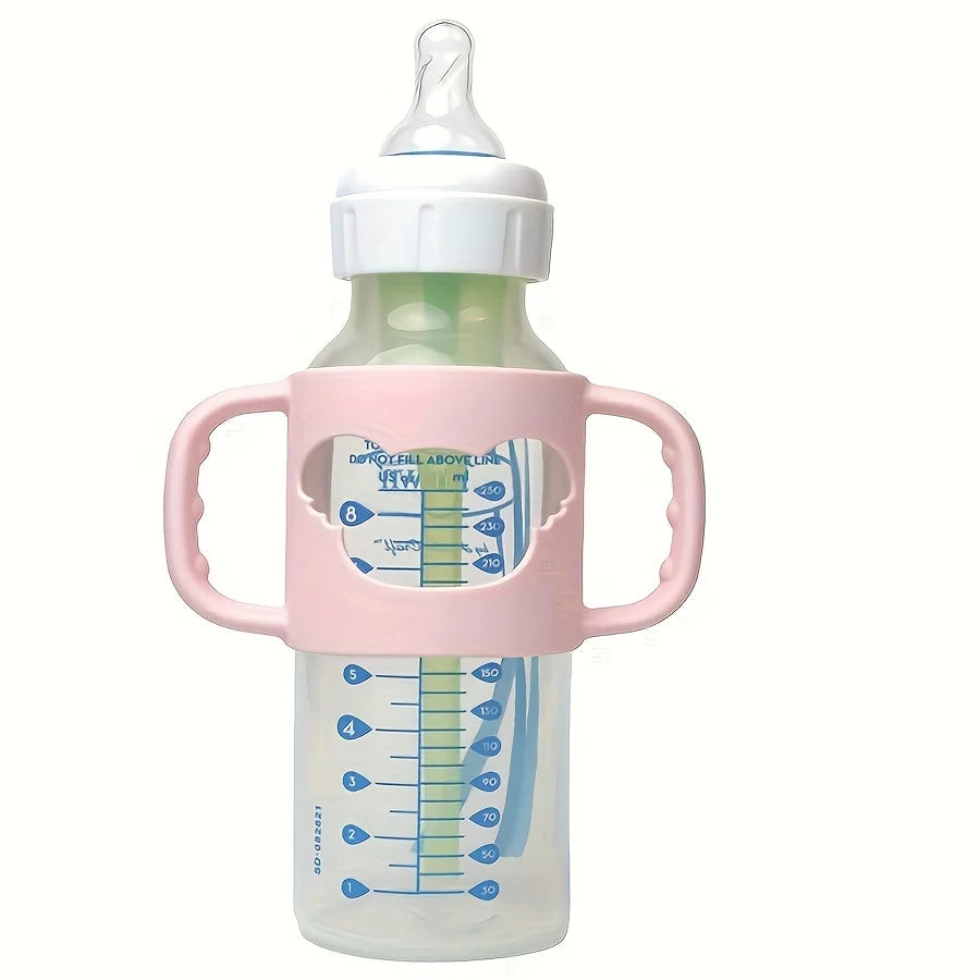 Pink silicone baby bottle handle for standard and wide-neck bottles, promoting independent feeding.