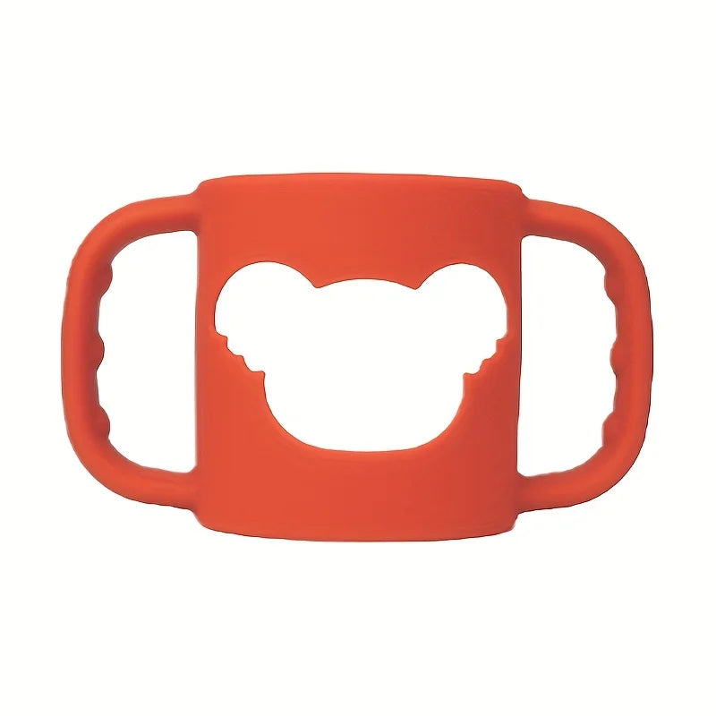 Orange silicone baby bottle handle with bear-shaped cutout, soft and flexible for easy grip.