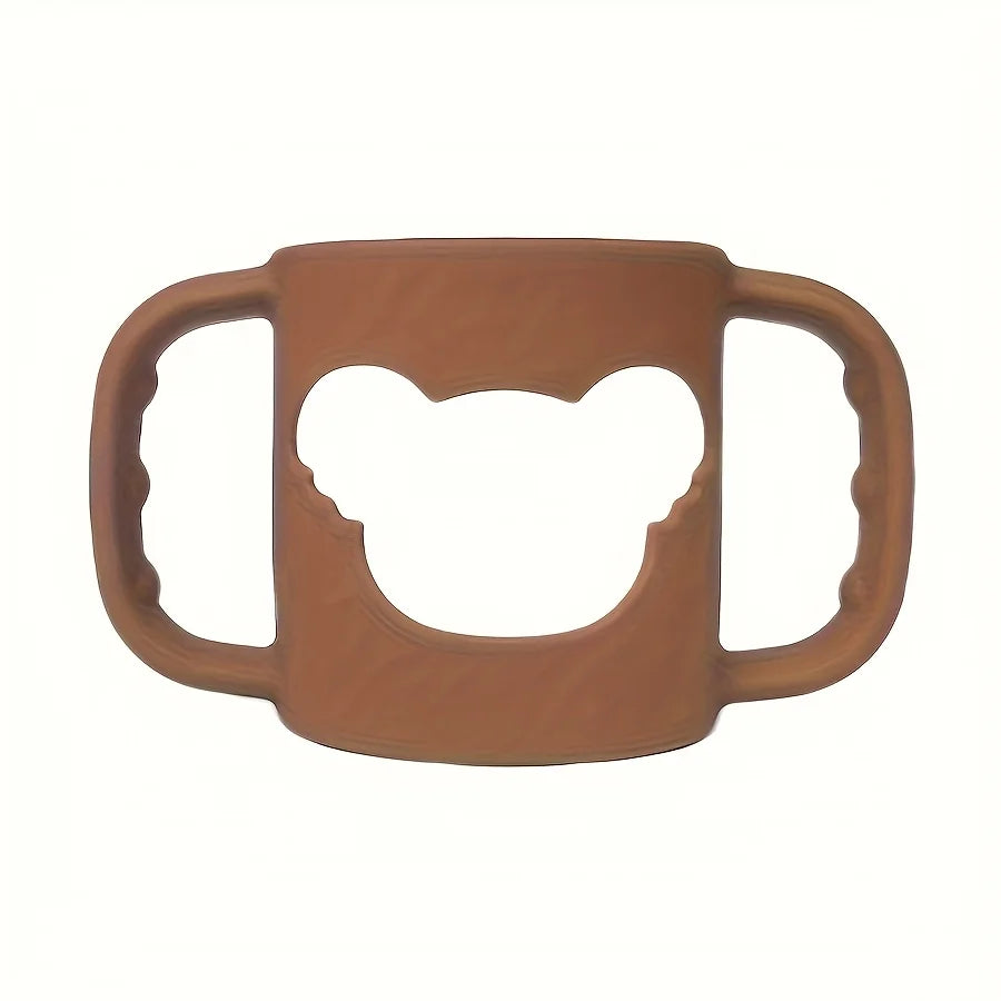 Soft brown silicone baby bottle handle with a bear-shaped cutout, designed for easy grip.